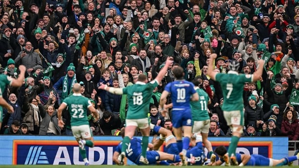 14 February 2026; Ireland supporters celebrate as Robert Baloucoune scores their side's third try during the Guinness 6 Nations Rugby Championship match between Ireland and Italy at the Aviva Stadium in Dublin. Photo by Ramsey Cardy/Sportsfile