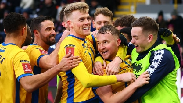 Mansfield Town's English midfielder #25 Louis Reed (C) celebrates with teammates after scoring their second goal during the English FA Cup fourth round football match between Burnley and Mansfield Town at Turf Moor in Burnley, north west England on Februa