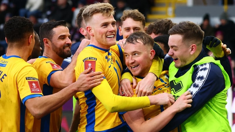 Mansfield Town's English midfielder #25 Louis Reed (C) celebrates with teammates after scoring their second goal during the English FA Cup fourth round football match between Burnley and Mansfield Town at Turf Moor in Burnley, north west England on Februa