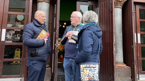  Rev David Moore, his wife Elaine and Jake Mac Siacais meeting outside the centre