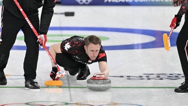 Ben Herbert (L), Marc Kennedy (C) and Brett Gallant of Team Canada compete in the curling men's round robin between Canada and USA during the Milano Cortina 2026 Winter Olympic Games at the Cortina Curling Olympic Stadium in Cortina d’Ampezzo on February