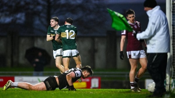 Keith Evans celebrates with team-mate Micheál Burns after scoring Kerry's first goal