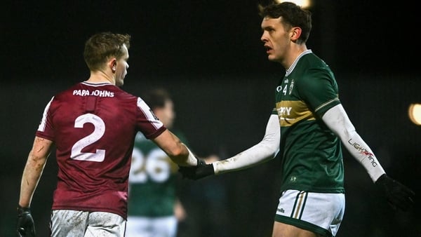 Galway's Johnny McGrath shakes hands with Kerry's David Clifford following the draw in Tralee
