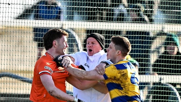 15 February 2026; Umpire Sylvie Maguire separates Ross McQuillan of Armagh, left, and Ronan Daly of Roscommon during the Allianz Football League Division 1 match between Roscommon and Armagh at King & Moffatt Dr Hyde Park in Roscommon. Photo by Seb Daly/S