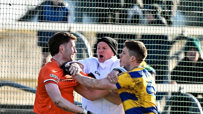 15 February 2026; Umpire Sylvie Maguire separates Ross McQuillan of Armagh, left, and Ronan Daly of Roscommon during the Allianz Football League Division 1 match between Roscommon and Armagh at King & Moffatt Dr Hyde Park in Roscommon. Photo by Seb Daly/S