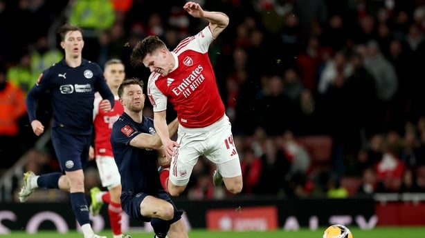 LONDON, ENGLAND - FEBRUARY 15: Will Aimson of Wigan Athletic tackles Viktor Gyoekeres of Arsenal and receives a yellow card during the Emirates FA Cup Fourth Round match between Arsenal and Wigan Athletic on February 15, 2026 in London, England. (Photo by Richard Pelham/Getty Images)