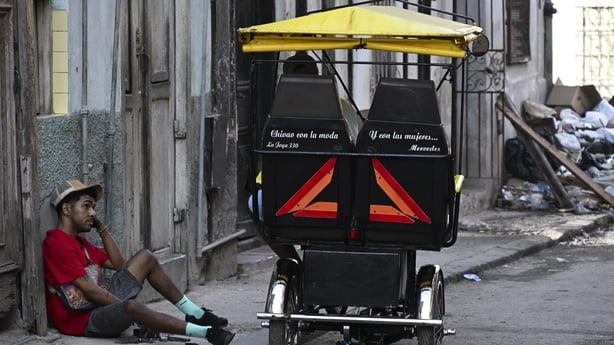 A bicitaxi is seen in a street of Havana, on February 13, 2026. The fuel crisis in Cuba, and particularly in Havana, is forcing many workers who depend on daily mobility to abandon gasoline cars and turn to electric tricycles and bicycle taxis as more accessible alternatives. (