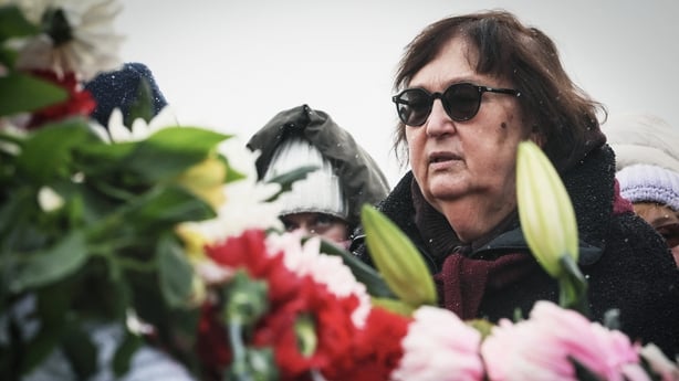 Lyudmila Navalnaya, mother of late Russian opposition leader Alexei Navalny, by floral arrangements at his grave