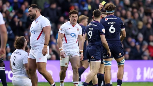 Henry Arundell of England is shown a yellow card by referee Nika Amashukeli (obscured) during 2026 Six Nations match against Scotland