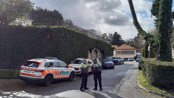 Police officers stand guard outside of the Oman ambassador residency where the indirect nuclear talks between the United States and Iran are taking place in Geneva on February 17, 2026
