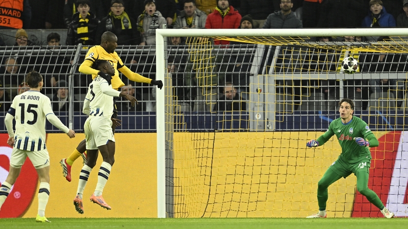 Dortmund's Guinean forward #09 Serhou Guirassy (L) scores his team's first goal during the UEFA Champions League knockout round play-off first Leg football match between BVB Borussia Dortmund and Atalanta Bergamo in Dortmund,