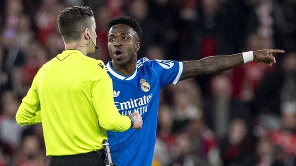 Vinícius Júnior of Real Madrid gestures reacting to racist abuse from fans during the UEFA Champions League 2025/26 League Knockout Play-off First Leg match between SL Benfica and Real Madrid C.F. at Estadio do SL Benfica on February 17, 2026 in Lisbon, P