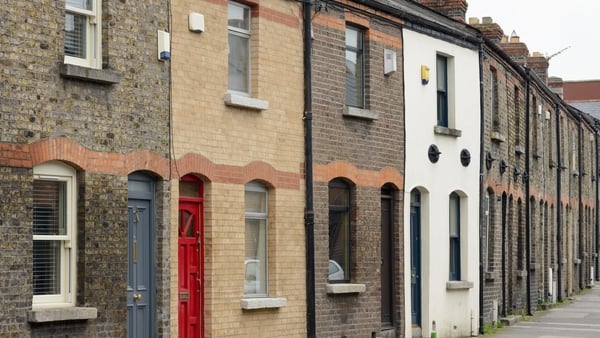 A street of traditional terraced brick houses in Dublin, Ireland