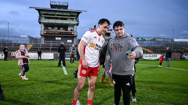 15 February 2026; Darragh Canavan of Tyrone takes a selfie with a supporter after the Allianz Football League Division 2 match between Tyrone and Cavan at O'Neill's Healy Park in Omagh, Tyrone. Photo by Ben McShane/Sportsfile