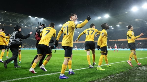 WOLVERHAMPTON, ENGLAND - FEBRUARY 18: Rodrigo Gomes and teammates of Wolverhampton Wanderers celebrate after Tom Edozie of Wolverhampton Wanderers scores his team's second goal during the Premier League match between Wolverhampton Wanderers and Arsenal at