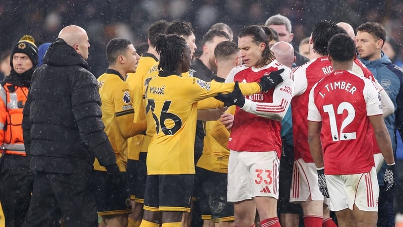 Mateus Mane of Wolverhampton Wanderers clashes with Riccardo Calafiori of Arsenal at full time during the Premier League match between Wolverhampton Wanderers and Arsenal at Molineux on February 18, 2026 in Wolverhampton, England