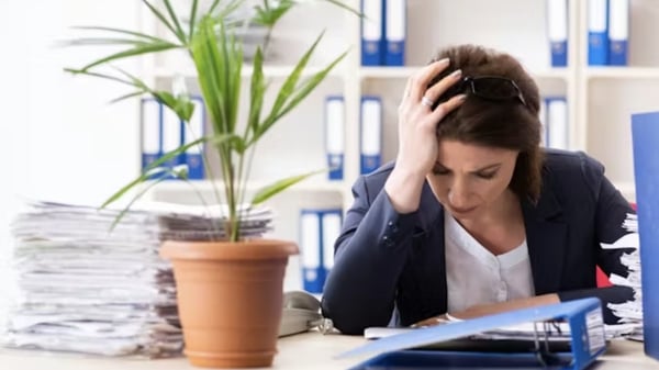 woman experiencing stress and burnout in office