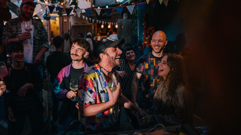 A lively gathering of friends dancing