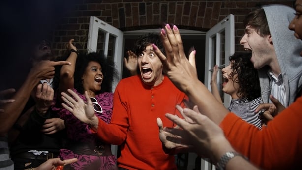 man shocked by friends throwing him a surprise party