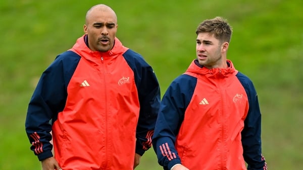 Simon Zebo, left, and Jack Crowley arrive for Munster rugby squad training at University of Limerick in Limerick.