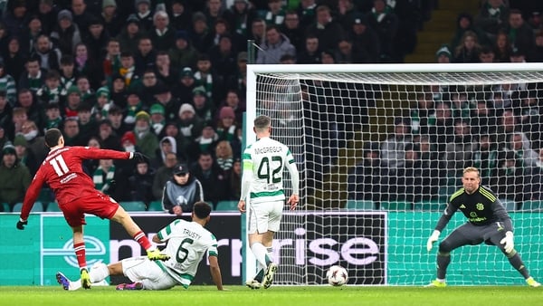 Bilal El Khannouss of VfB Stuttgart scores his team's first goal past Kasper Schmeichel of Celtic whilst under pressure from Auston Trusty of Celtic during the UEFA Europa League 2025/26 Knockout Play-off First Leg match between Celtic FC and VfB Stuttgar