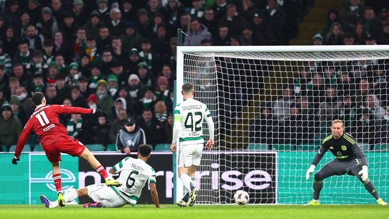 Bilal El Khannouss of VfB Stuttgart scores his team's first goal past Kasper Schmeichel of Celtic whilst under pressure from Auston Trusty of Celtic during the UEFA Europa League 2025/26 Knockout Play-off First Leg match between Celtic FC and VfB Stuttgar