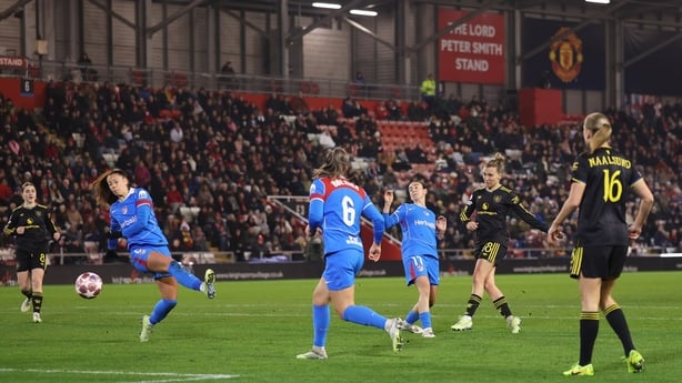 Julia Zigiotti Olme of Manchester United scores her team's first goal while under pressure from Julia Bartel of Club Atletico de Madrid during the UEFA Women's Champions League 2025/26 KO play-offs Second Leg match between Manchester United Women and Club Atletico de Madrid at Leigh Sports Village o