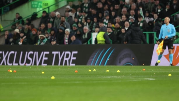 Balls are thrown onto the pitch as part of a Celtic fan Protest during a UEFA Europa League Play-Off First Leg match between Celtic and VFB Stuttgart at Celtic Park, on February 19, 2026, in Glasgow, Scotland. 