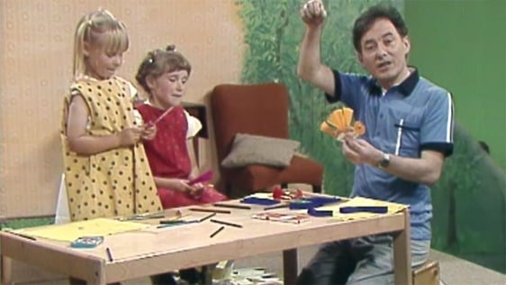 Friends Róisín and Caoimhe help 'Dilín Ó Deamhas' presenter Aidan O'Hara make small birds from card…