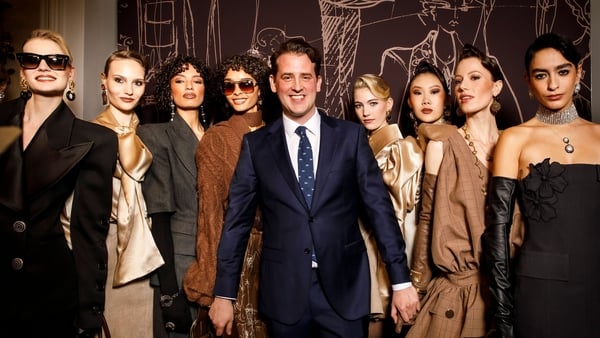 Paul Costelloe models standing with William