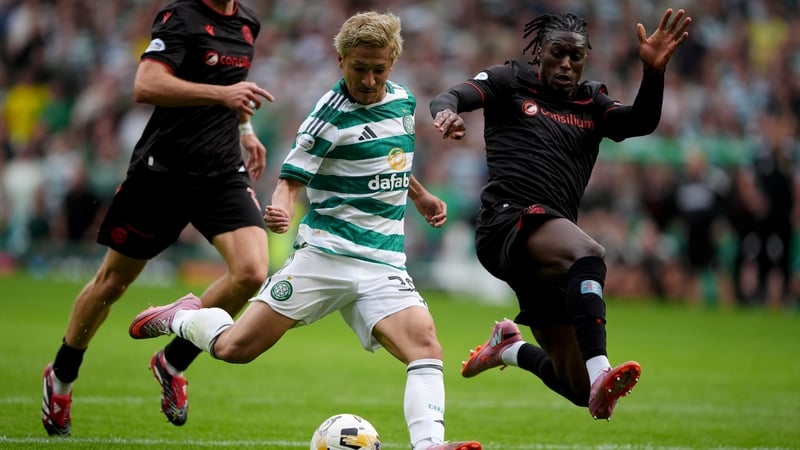 St Mirren's Tunmise Sobowale (right) challenges Celtic's Daizen Maeda (centre) during the William Hill Premiership match at Celtic Park, Glasgow. Picture date: Sunday August 3, 2025.