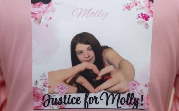 A photo of the deceased, Molly Dempsey, printed on the back of a top