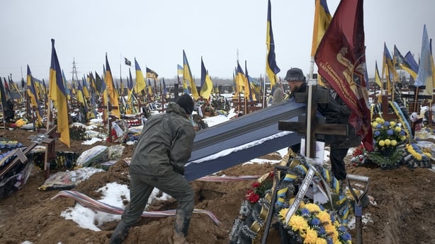 KHARKIV, UKRAINE - JANUARY 8: Funeral ceremonies take place during the burial of several Ukrainian soldiers at Military Cemetery No. 18 in Kharkiv, as relatives, fellow servicemen and mourners gather to pay their last respects amid Russia's ongoing invasion of Ukraine, on January 8, 2026 in Kharkiv,
