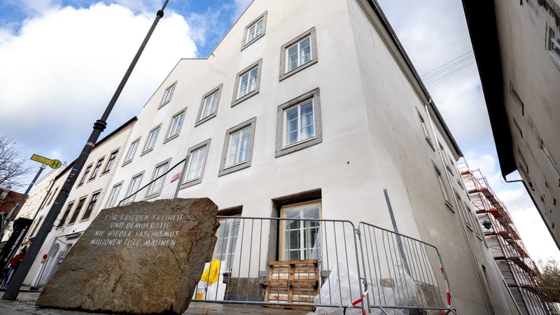 Picture taken on February 17, 2026 shows a memorial stone reading "For Peace, Freedom and Democracy - Never Again Fascism - Millions of Dead Warn" in front of the birth house of Adolf Hitler