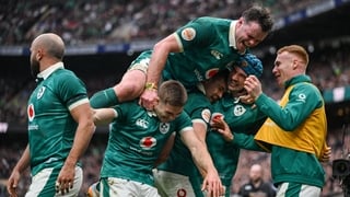 21 February 2026; Ireland players, including Jack Crowley, James Ryan, Garry Ringrose, Tadhg Beirne and Ciarán Frawley, celebrate their side's first try, scored by teammate Jamison Gibson-Park, left, during the Guinness 6 Nations Rugby Championship match