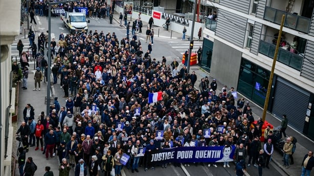 Protesters attend a march in Lyon