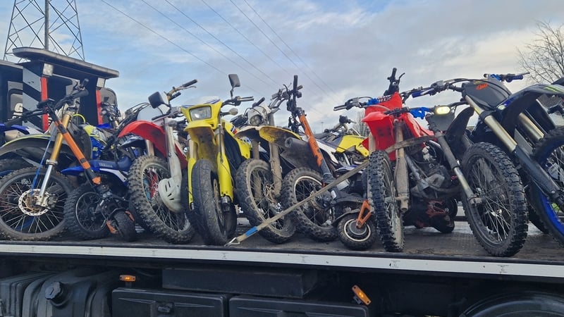 a number of scrambler bikes secured on top of a flat bed truck