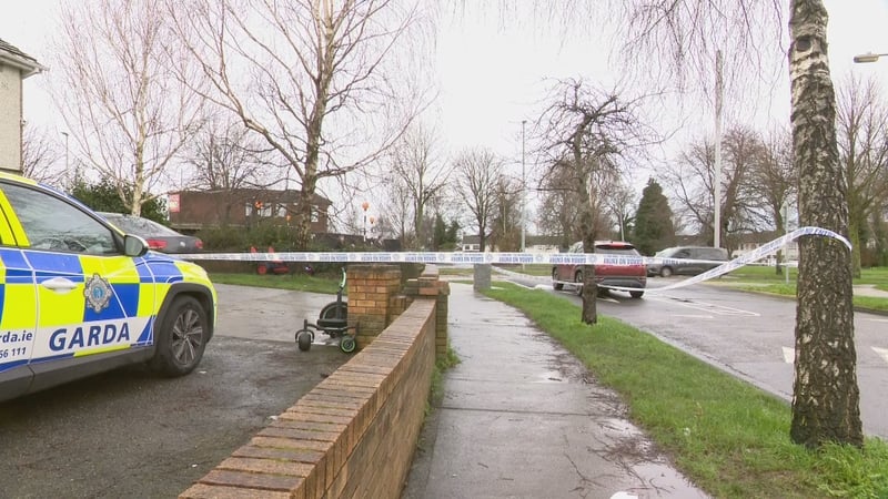 View of garda car and tape outside house