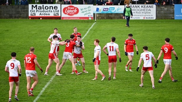 22 February 2026; Dermot Campbell of Louth and Eoin McElholm of Tyrone tussle during the Allianz Football League Division 2 match between Louth and Tyrone at DEFY Pairc Mhuire in Ardee, Louth. Photo by Shauna Clinton/Sportsfile