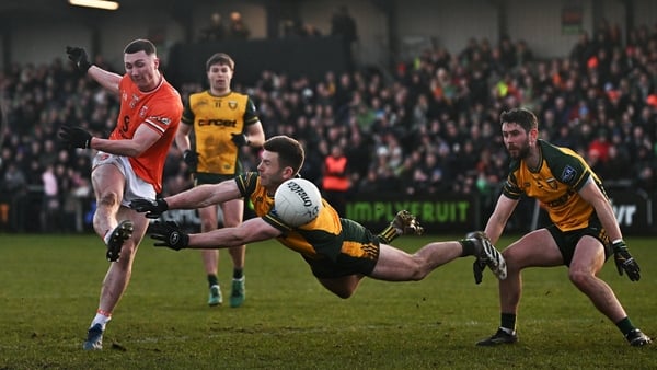 22 February 2026; Oisín Conaty of Armagh shoots under pressure from Eoghan Bán Gallagher of Donegal during the Allianz Football League Division 1 match between Armagh and Donegal at BOX-IT Athletic Grounds in Armagh. Photo by Ramsey Cardy/Sportsfile