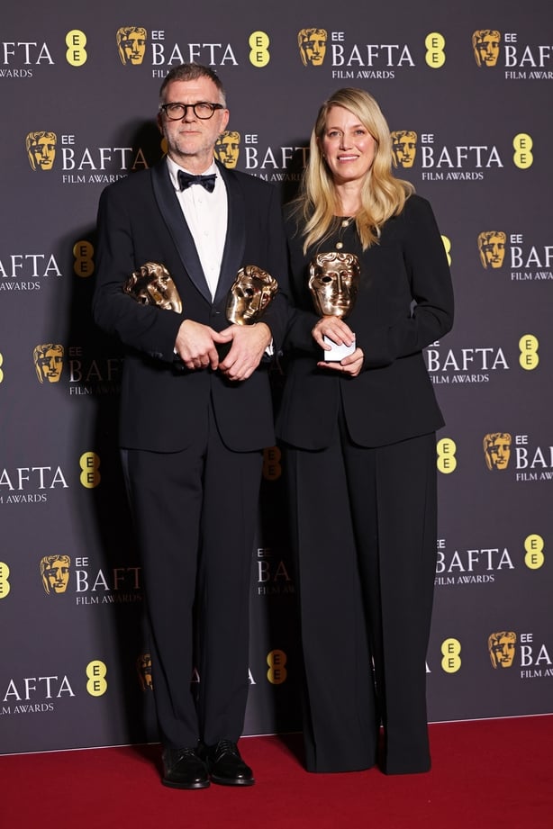 LONDON, ENGLAND - FEBRUARY 22: Paul Thomas Anderson (L) and Sara Murphy, winners of the Director Award, Adapted Screenplay Award and Cinematography Award for 'One Battle After Another' pose in the winners room at the 2026 EE BAFTA Film Awards at The Royal Festival Hall on February 22, 2026 in London