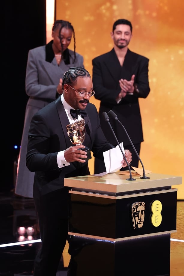 LONDON, ENGLAND - FEBRUARY 22: Ryan Coogler accepts the Original Score Award for 'Sinners' on behalf of Ludwig Göranssonon stage during the EE BAFTA Film Awards 2026 at The Royal Festival Hall on February 22, 2026 in London, England. (Photo by Tristan Fewings/BAFTA/Getty Images for BAFTA)