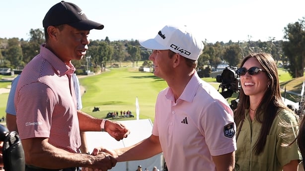 PACIFIC PALISADES, CALIFORNIA - FEBRUARY 22: Jacob Bridgeman of the United States is congratulated by Tiger Woods after putting in to win on the 18th green during the final round of The Genesis Invitational 2026 at Riviera Country Club on February 22, 2026 in Pacific Palisades, California. (Photo by