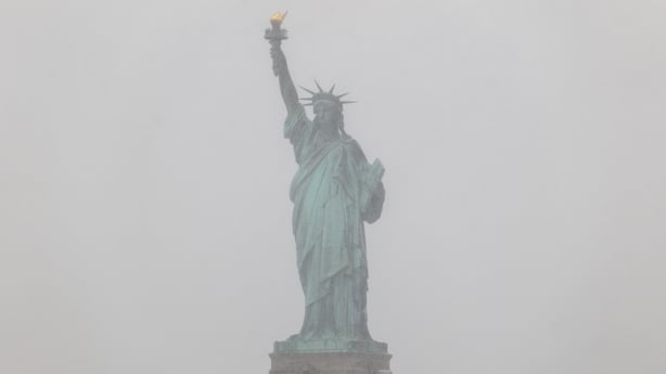 NThe Statue of Liberty is partly obscured as snow begins to fall as the city braces for a blizzard on Sunday into Monday, February 22, 2026, in New York City. The northeast U.S.is bracing for an intense nor'easter with blizzard conditions