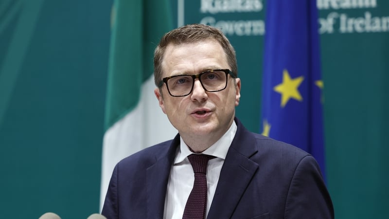 Minister for Housing, Local Government and Heritage, James Browne speaking at a podium