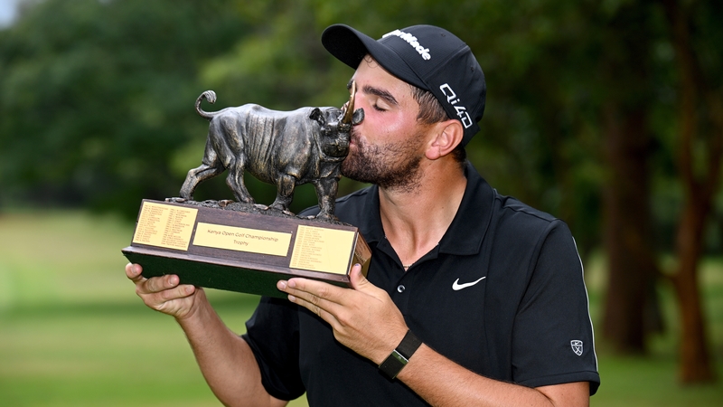 NAIROBI, KENYA - FEBRUARY 22: Casey Jarvis of South Africa poses with the trophy following victory on day four of the Magical Kenya Open 2026 at Karen Country Club on February 22, 2026 in Nairobi, Kenya. (Photo by Stuart Franklin/Getty Images)
