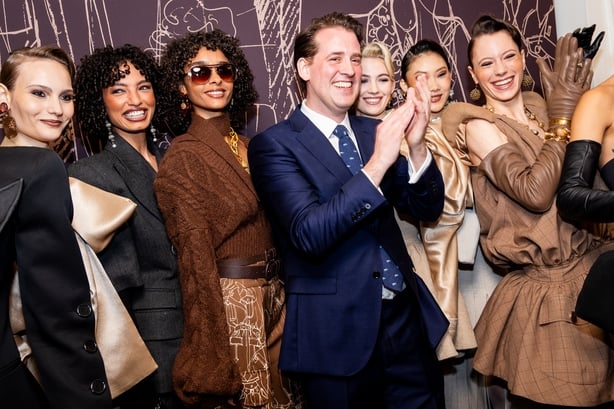 LONDON, ENGLAND - FEBRUARY 19: William Costelloe poses with models backstage at the Paul Costelloe show during London Fashion Week February 2026 at The Waldolf Hilton Hotel London on February 19, 2026 in London, England. (Photo by Tristan Fewings/Getty Images)