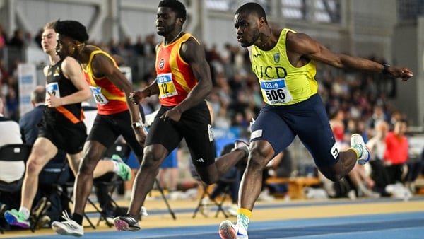 23 February 2025; Bori Akinola of UCD AC, Dublin, right, crosses the line to win the men's 60m final ahead of Israel Olatunde of Tallaght AC, Dublin, centre, who finished third, during day two of the 123.ie National Senior Indoor Championships at the Nati
