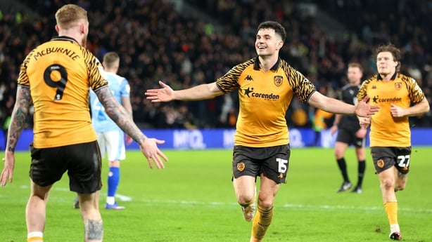 HULL, ENGLAND - FEBRUARY 24: John Egan of Hull City celebrates scoring his team's third goal with teammate Oliver McBurnie during the Sky Bet Championship match between Hull City and Derby County at MKM Stadium on February 24, 2026 in Hull, England. (Photo by Tony King/Getty Images)