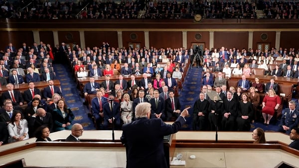 a view from behind donald trump as he makes a speech